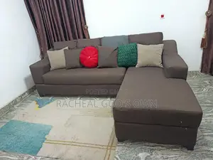 L Shaped Fabric Sofa With 6 Throw Pillows.
