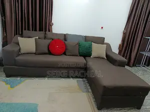 L Shaped Fabric Sofa With 6 Throw Pillows.