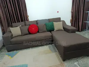 L Shaped Fabric Sofa With 6 Throw Pillows.
