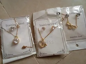 3 Gold Neck Piece, a Silver Neck Piece and a Gold Vancleef Bracelet