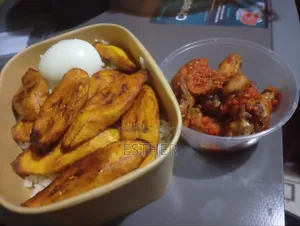Pack of White Rice Chicken Wings Plantain Egg and Stew