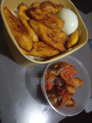 Pack of White Rice Chicken Wings Plantain Egg and Stew