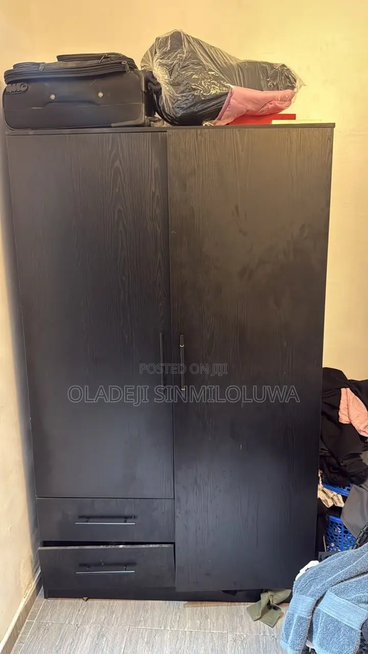 A Black Polished Wardrobe Without Damage or Peels
