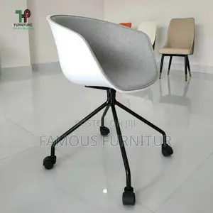 Modern Rolling Swivel Bucket Chairs Feature an Ergonomic Curve