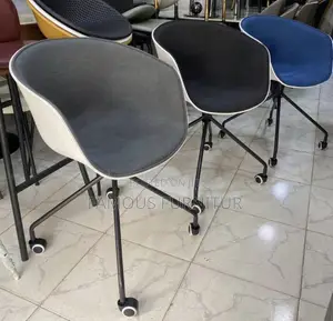 Modern Rolling Swivel Bucket Chairs Feature an Ergonomic Curve
