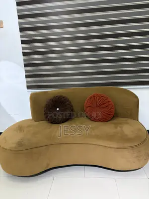 A Newly Used Comfortable Three Seater Sofa With Throw Pillows