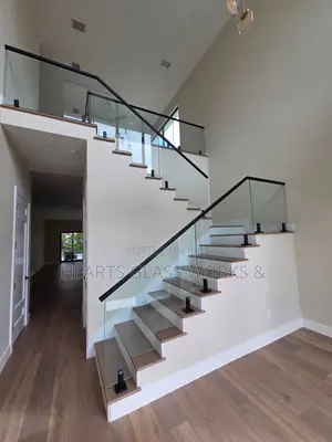 Modern Spigot Staircase Glass Railing Installation
