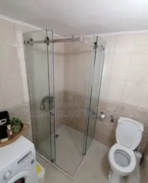 Modern and Space-Saving Sliding Bathroom Door With Toughened Glass