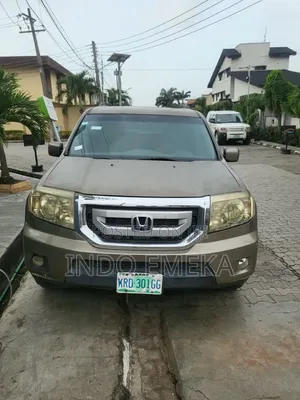 Honda Pilot Touring w/RES/Navi FWD (3.5L 6cyl 5A) 2011 Gold