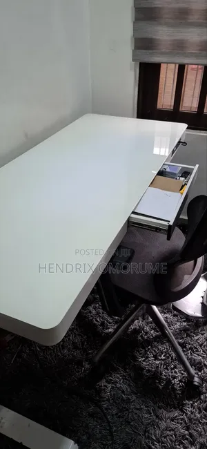 Glasstop Electric Height Adjustable Gaming Table and Gaming Chair.
