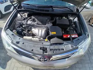Toyota Camry LE 4dr Sedan w/Prod. End 11/13 (2.5L 4cyl 6A) 2014 Gold