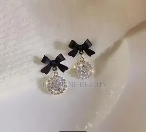Beautiful Bow Earrings and Diamond Drop