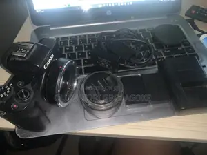 Canon M50 With 22mm Lens, 3 Batteries (1 Dummy Battery) and Adapter