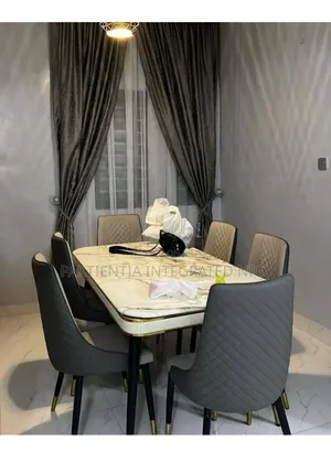 Dining Table With Six Sets of Seats.