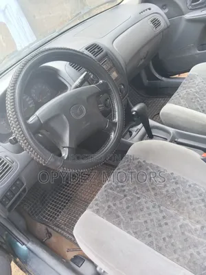 Mazda 323 2004 Green