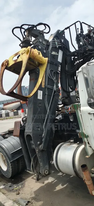 American Used UD Mack Mounted Grapple Tractor