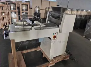 A Dough Moulder Is a Bakery Machine Used to Shape and Roll Dough