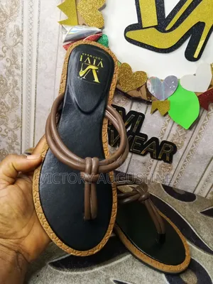 Female Slippers With Black Flour and Brown Edges
