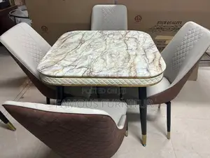 This Round Marble Dining Set Features a White Marble-Top Table
