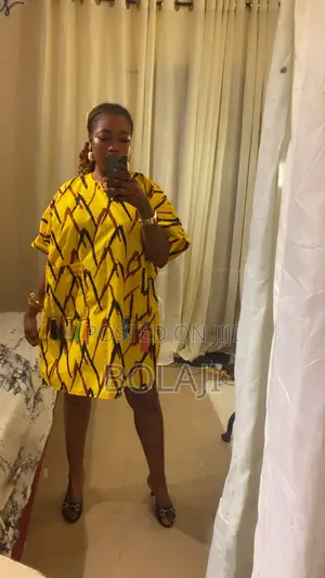 A Knee Length Ankara Dress With Tassels