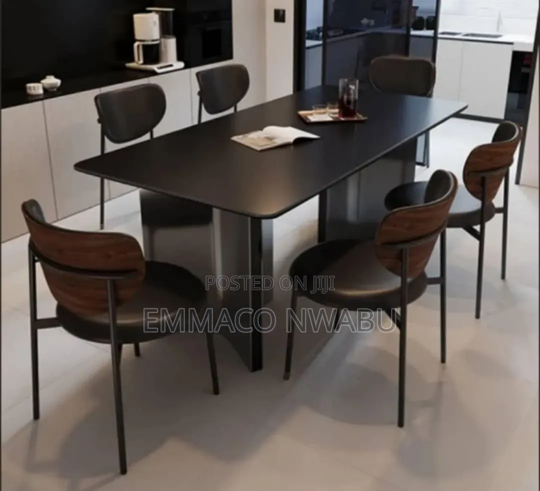 Modern Black Dining Table Set With Curved Chairs.