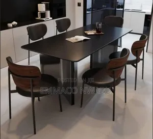 Modern Black Dining Table Set With Curved Chairs.