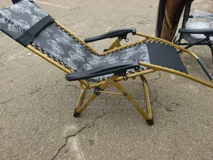 Foldable Outdoor Zero-Gravity Reclining Lounge Chair With a Gold-Toned