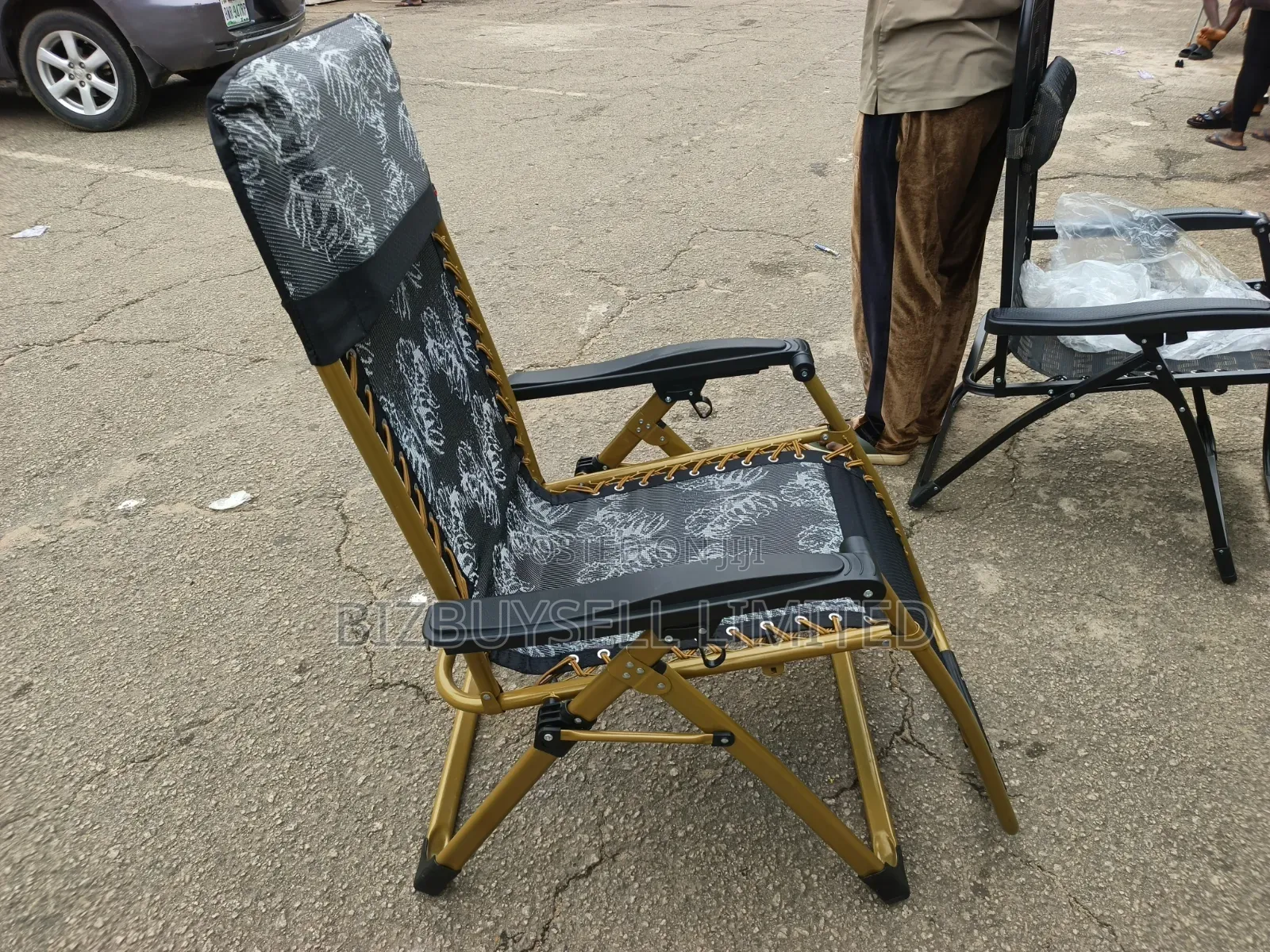 Foldable Outdoor Zero-Gravity Reclining Lounge Chair With a Gold-Toned
