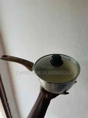 Neatly Used Ceramic Saucepan With Lid