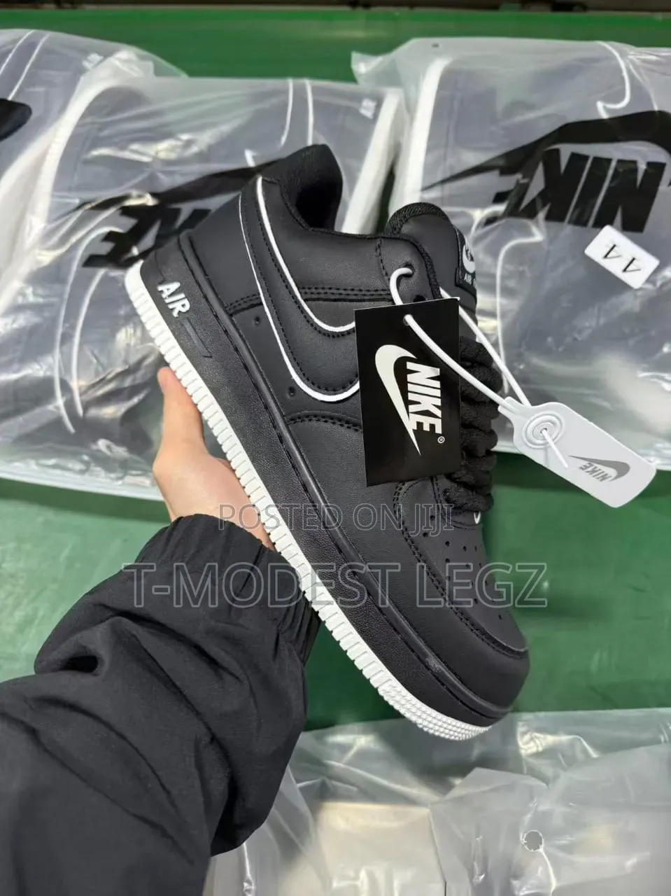 Black Solid Nike Shoes With White Strike