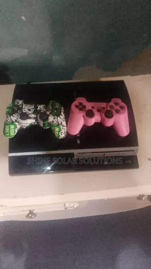 PS3 With 2 Pads and 4 Games