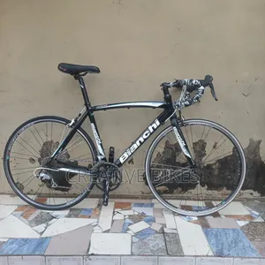 Clean White Professional Bianchi 9-Speed Road Bike With Carbon Fork