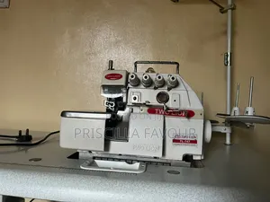 Barely Used Neat Two Lion TL-747 4 Threads Industrial Overlock Machine
