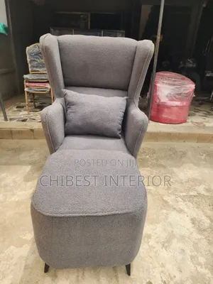 Neatly Padded Sofa With Leg Rest.