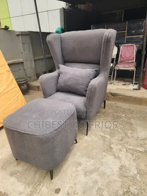 Neatly Padded Sofa With Leg Rest.