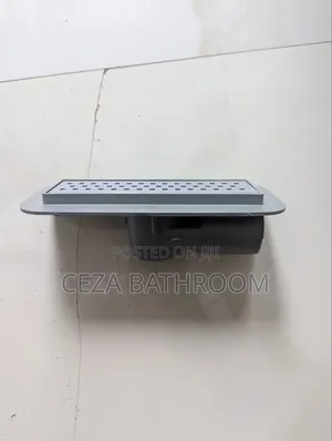 Floor Drain or Shower Channel Drain With a Slotted Rectangular Grate