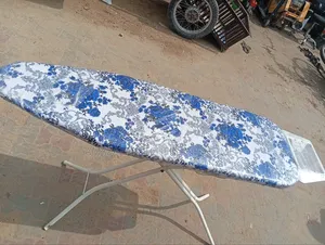 Foreign Foldable Ironing Board With Metallic Rest".