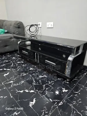 Tempered Glass Top Foreign TV Stand - Black & Silver
