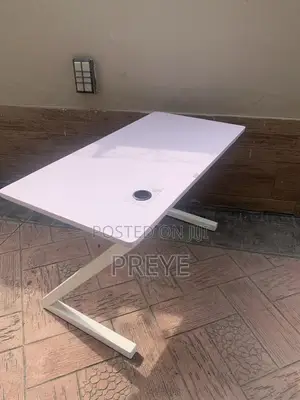 Minimalist White Desk With Z-Shaped Legs and Built-in Cable Management