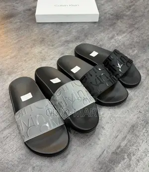 Calvin Klein Embossed Logo Slider Sandals | Black & Transparent