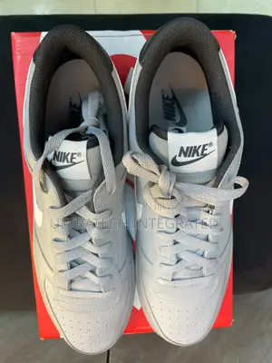 Nike Men’s Dunk Low Embossed Big Logo Sneaker