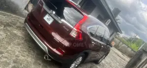 Honda CR-V Touring 4dr SUV AWD (2.4L 4cyl CVT) 2015 Red