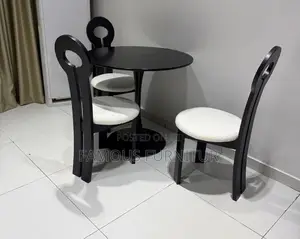 Modern Black Round Dining Set With White Boucle-Upholstered Chairs