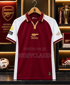 Arsenal 2025/26 Champions Football Jersey – White & Burgundy