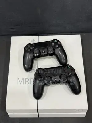 Uk Used Ps4 Fat With Two Pads and 10 Games