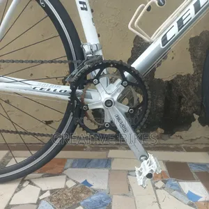 Clean Sharp White Professional 9-Speed Road Bike With Carbon Fork