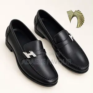 Men’s Black Leather-Style Penny Loafers With Silver H-Buckle Detail