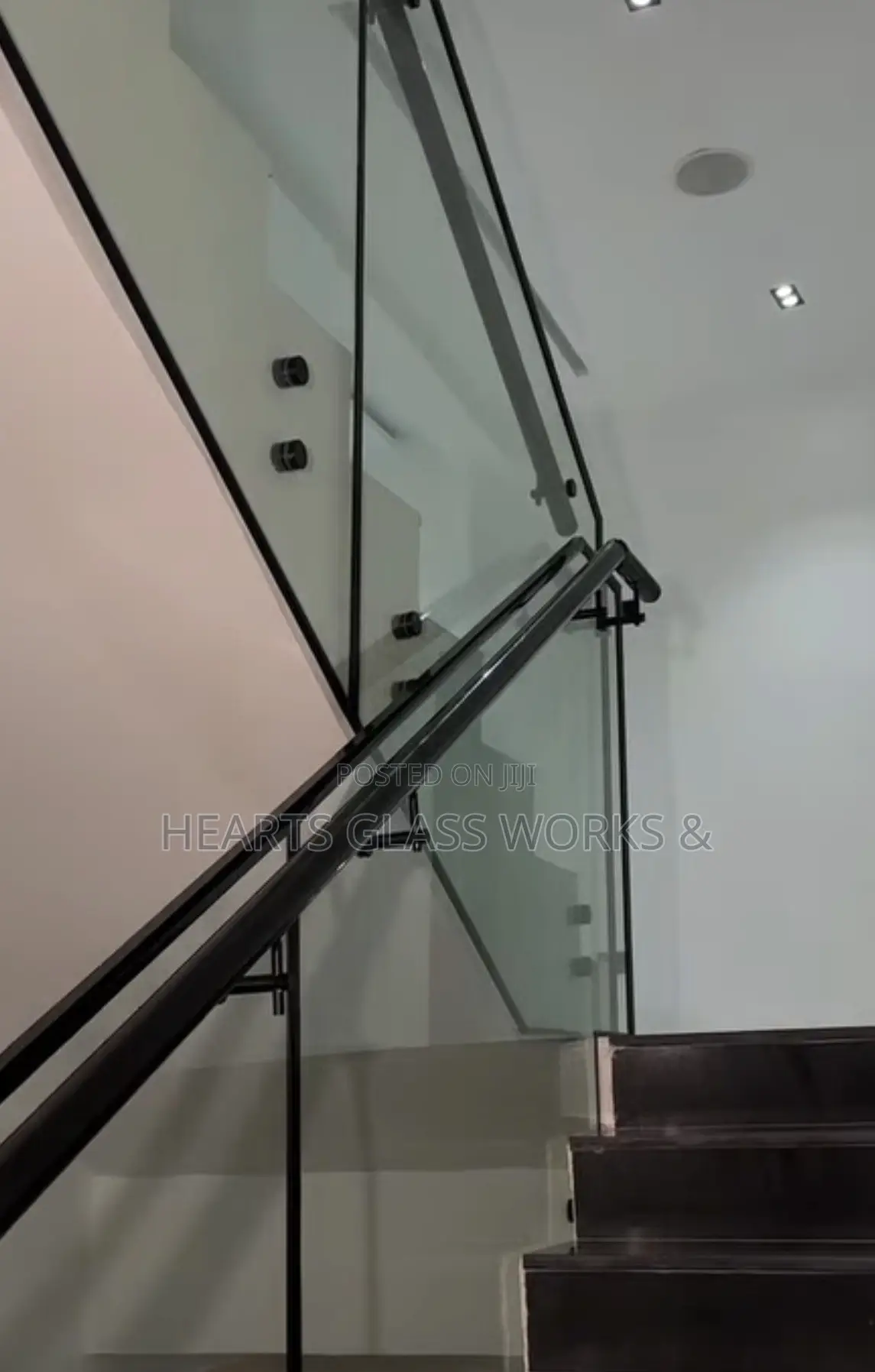 Frameless Glass Staircase Railing With Black Handrail