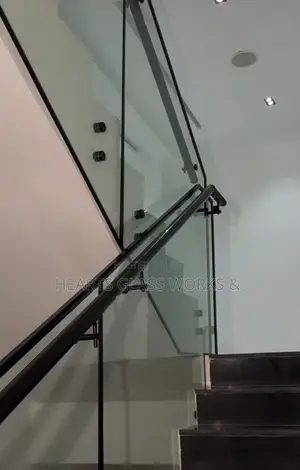 Frameless Glass Staircase Railing With Black Handrail