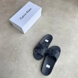 Calvin Klein Embossed Monogram Slider Sandals